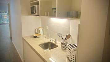Exclusive Studio, City View (LC1) | Private kitchen | Fridge, microwave, oven, stovetop