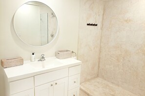 Shower, hair dryer, towels, soap