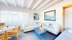 Family Suite, Multiple Beds | Living area | Flat-screen TV, books - Tomales Bay Resort and Marina  (Inverness)