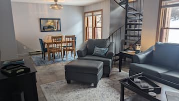 Smart TV, fireplace, books, printers