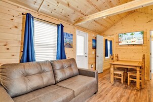 Deluxe Cabin | Living area | 43-inch Smart TV with satellite channels