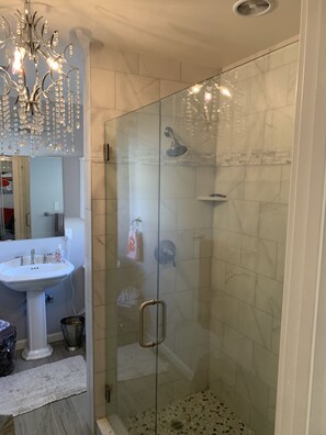 Shower, hair dryer, towels, soap