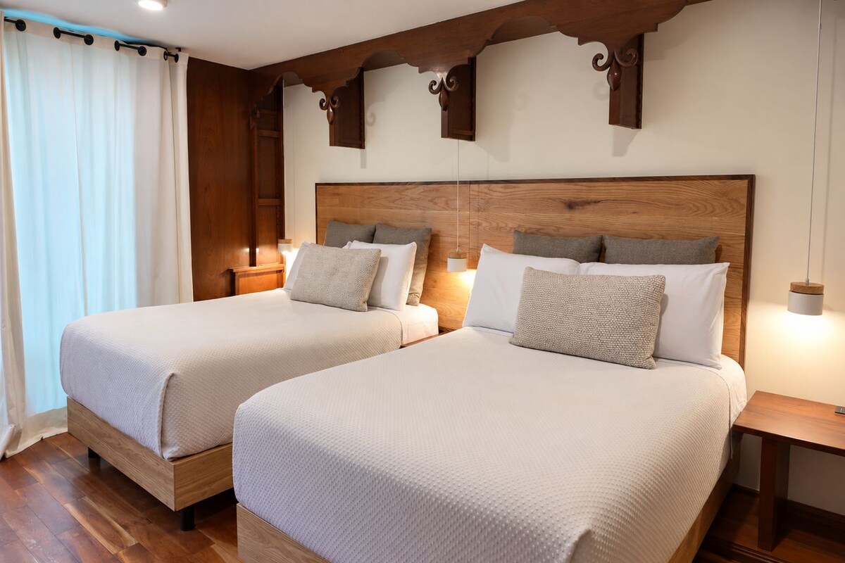 Family Room | Premium bedding, desk, laptop workspace, blackout drapes