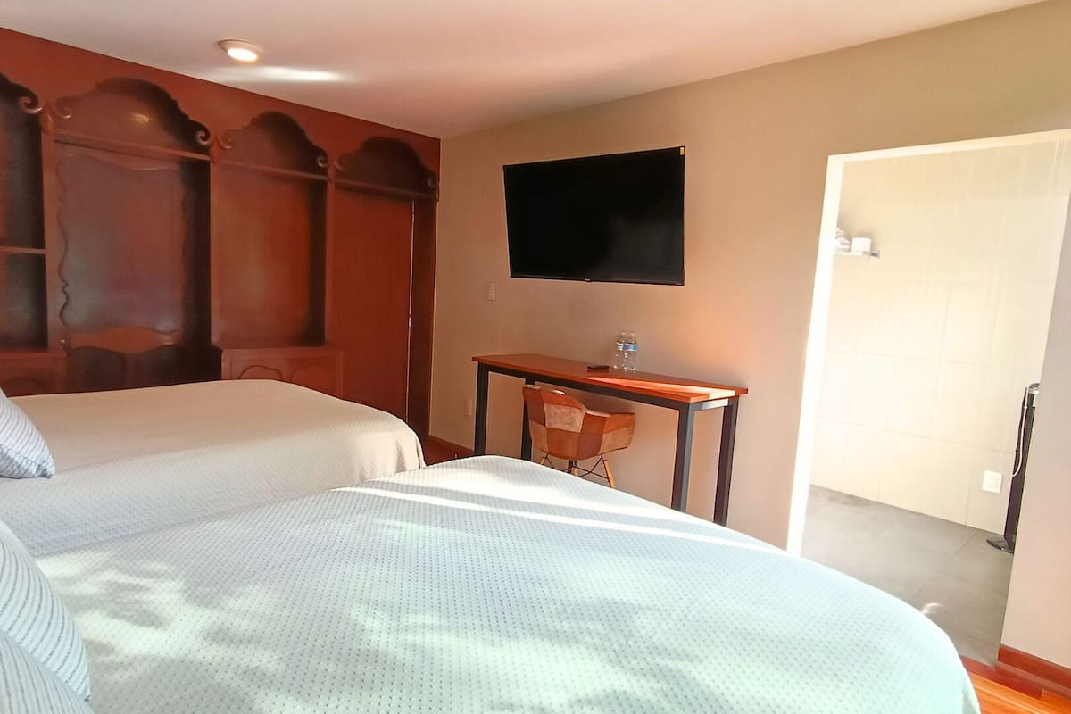 Family Room | Premium bedding, desk, laptop workspace, blackout drapes