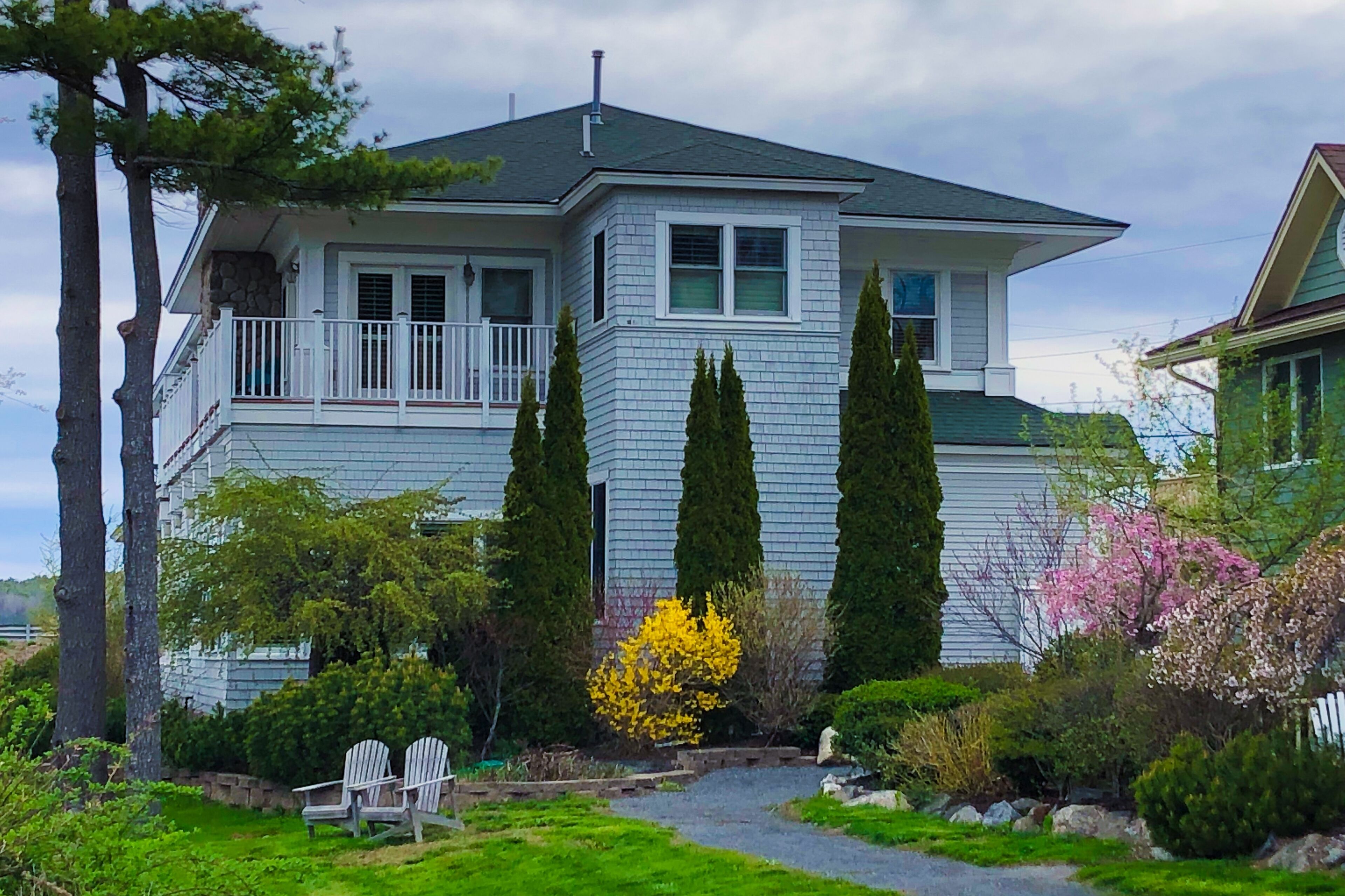 Custom riverfront townhome with amazing view, dock, boat slips & location