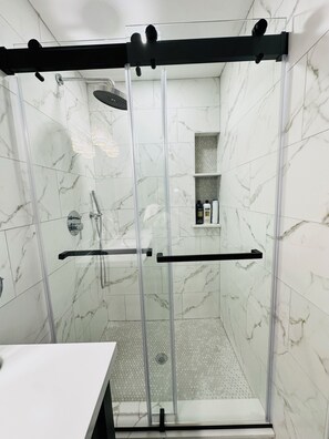Shower, towels, soap, toilet paper