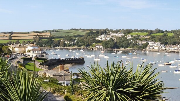 A marina with boats, a hotel named 'Green Bank Hotel,' and surrounding greenery. - 1 bedroom accommodation in Falmouth (Falmouth)