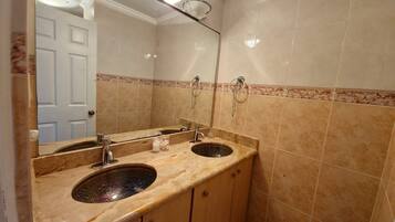 Shower, hair dryer, towels, soap