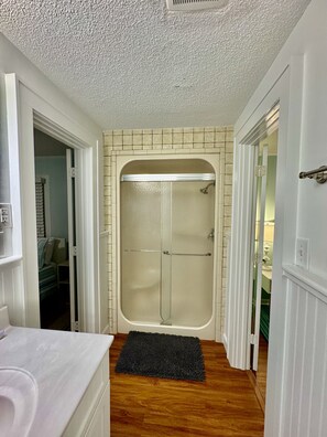 Shower, hair dryer, towels, soap