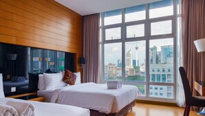 A hotel room with two beds, a large window with a city view, and a wooden panel wall. - Dua Sentral KL Sentral (Kuala Lumpur)