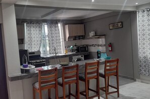 Fridge, microwave, oven, stovetop - Cozy two bedroom Apartment in Kasoa (KASOA)