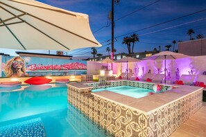 A swimming pool with a tiled deck, a hot tub, and a mural with the text "Blushica Sanctuary". - Blushing Señorita 6BR 8Bed Pool82° HotTub102° (Scottsdale)