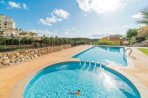A swimming pool with a stone wall and a clear blue sky. - Mediterranean 2 Bed Apart with Com Pool LR1248 (Dehesa de Campoamor)