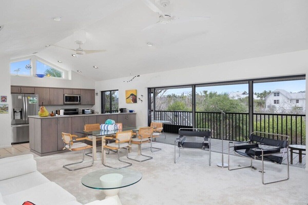 Living room with flat screen TV, overlooking lake