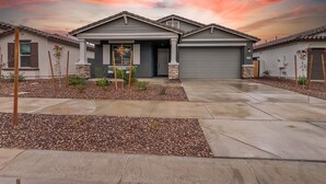 A modern two-story house with a garage, a front porch, and a landscaped front yard. - 3BR w playroom, community pool/spa! (Queen Creek)