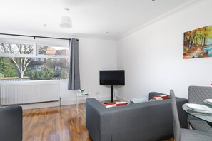 Apartment, 4 Bedrooms | Living area
