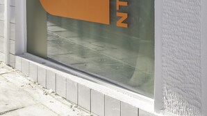 A window with the text "NTRANCE" and a sign indicating "Sleeping". - Cabins Sleeping Mets (Athens)