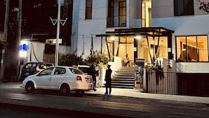 A modern hotel with a sign reading "COTHOTEL room booking". - Cot Hotel (Addis Ababa)