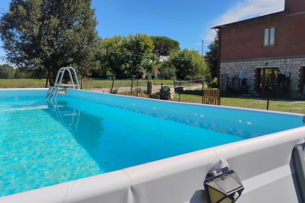 PISCINA CON GIARDINO E VISTA PANORAMICA