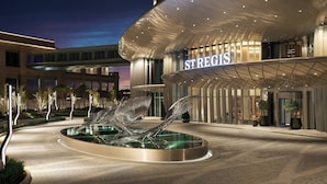 A modern hotel with a curved facade, a prominent entrance, and a central water feature. - The St. Regis Belgrade (Belgrade)