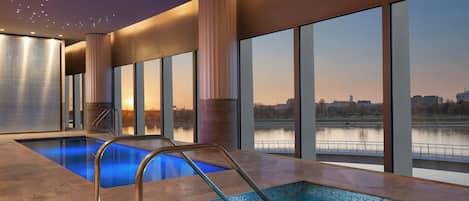 Indoor pool, open 8:00 AM to 10:00 PM, pool loungers