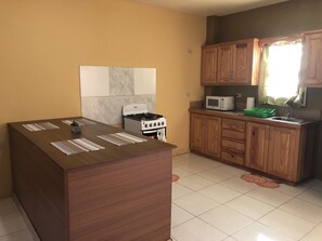 Fridge, microwave, oven, stovetop - Curepe Apartment (Tunapuna/Piarco Regional Corporation)