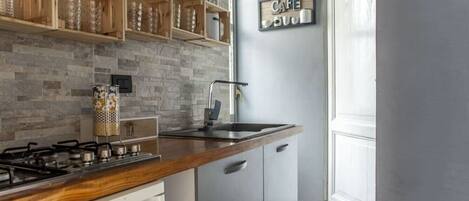 Fridge, microwave, stovetop, coffee/tea maker