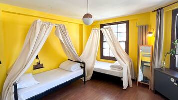 Bed in 6 Bed Mixed Room with Private Bathroom | Premium bedding, blackout drapes, soundproofing, iron/ironing board