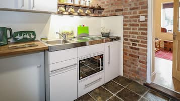Fridge, electric kettle, toaster, cookware/dishes/utensils