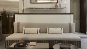 A modern living room with a sofa, coffee table, and side table. - Ergon Bakehouse Athens (Athens)