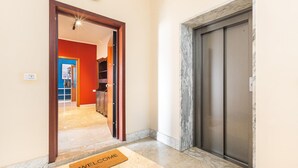A hotel entrance with a marble floor, a welcome mat, and a closed elevator door. - 3688 Casa Fortuna by Barbarhouse (Gallipoli)