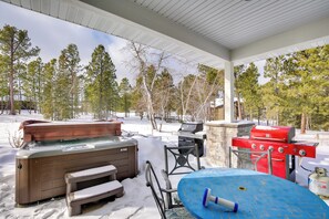 A covered outdoor area with a hot tub, grill, and seating. - Modern Lead Cabin w/ Hot Tub, 6 Mi to Skiing! (Lead)