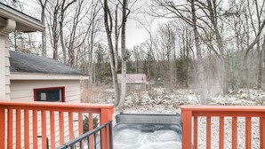 A hot tub on a wooden deck with a view of a house and trees in the background. - Rector Home w/ Hot Tub ~ 6 Mi to Ligonier! (Ligonier)