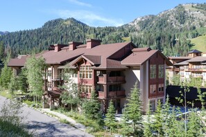 A multi-story lodge with balconies and a mountain backdrop. - 2405 - Two Bedroom Standard Eagle Springs East 2 Condo by RedAwning (Solitude)