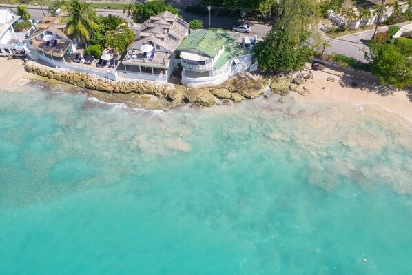 Relax on the balcony with a serene ocean view.