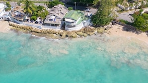 A coastal property with a large house, a boat dock, and a beach. - Easy Reach by Blue Sky Luxury (Mullins)