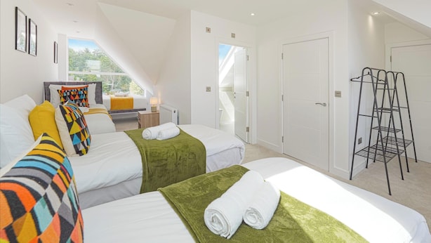 A hotel room with two beds, a ladder, a desk, and a view of the outdoors. - Huge House, Contractors/Families, 2X Free Parking (Hampshire)