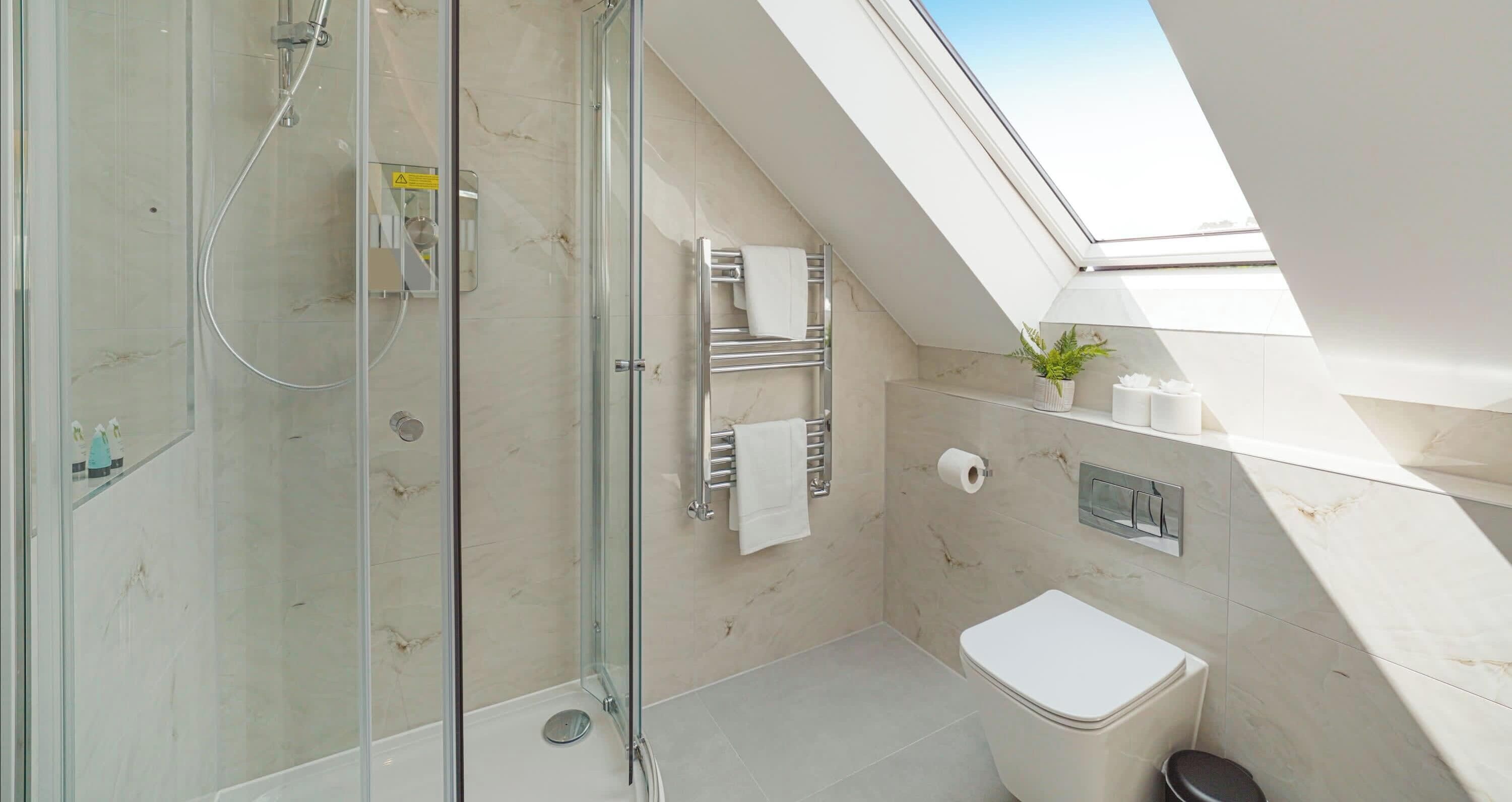 Shower, hair dryer, towels, shampoo