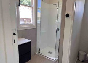Shower, hair dryer, towels, soap