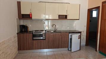 Fridge, oven, coffee/tea maker, cookware/dishes/utensils