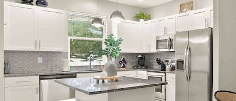 Coffee/tea maker, fridge, microwave, oven