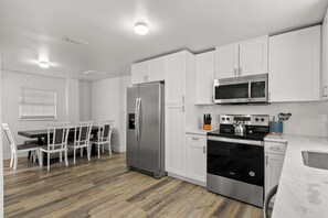 Coffee/tea maker, fridge, microwave, oven
