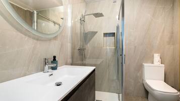 Shower, hair dryer, towels, soap