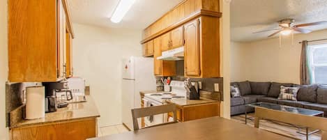 Fridge, stovetop, coffee/tea maker, cookware/dishes/utensils
