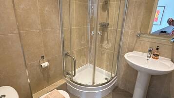 Shower, hair dryer, towels, soap