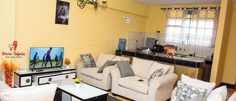 Business Apartment | Living area | 24-inch Smart TV with digital channels