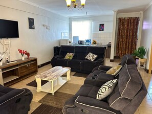 Comfort Apartment | Living area | 24-inch Smart TV with digital channels - Lux Suites Fox Hills Apartments Nanyuki (Nanyuki)
