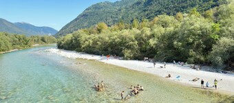 Apartment Matajur 100 m2 in holiday house Maharac (part of socaholidays) with 3 bedrooms, mid floor, sleep till 6, large garden, BBQ and all comfort.