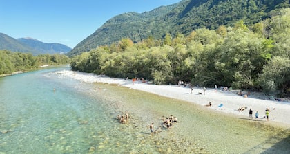 Apartment Matajur 100 m2 in holiday house Maharac (part of socaholidays) with 3 bedrooms, mid floor, sleep till 6, large garden, BBQ and all comfort.