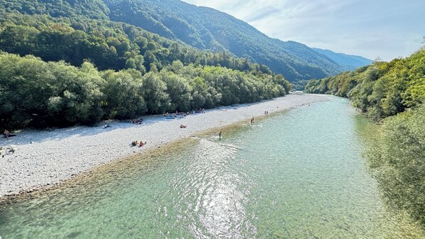 Beach - Apartment Krn 90 m2 in holiday house Maharac (part of socaholidays) with 3 bedrooms, top floor, airconditioning, sleep till 6, own balcony and terrace next to the shared garden and BBQ. (Tolmin)